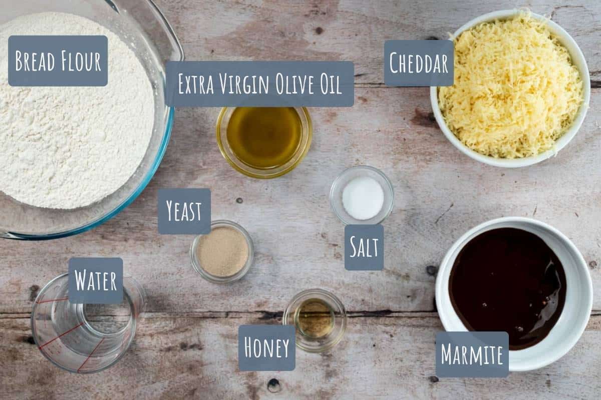 A labelled photo of all the ingredients needed to make cheese and Marmite bread.