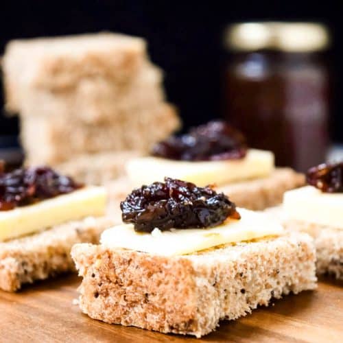 Onion Chutney on top of sliced bread and cheese.