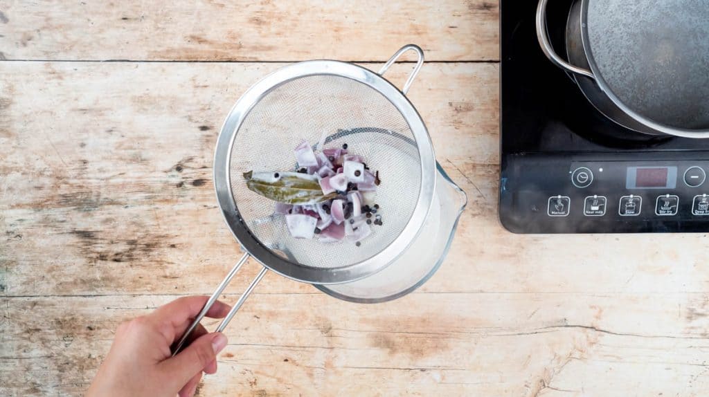 I had this using a sieve to strain the milk into the jug.