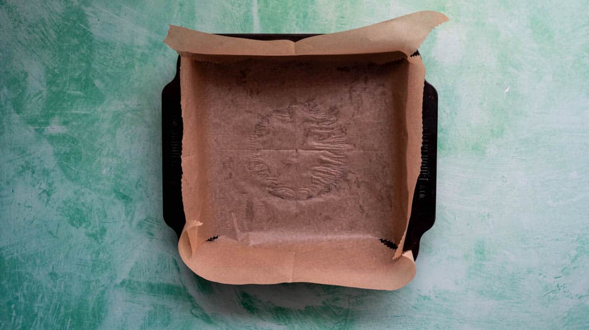 A 20cm square baking tin lines with baking paper.
