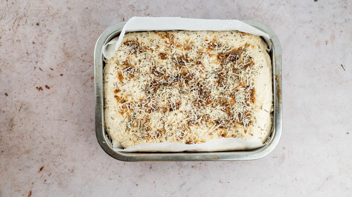 The dough inside the baking tin that has risen.