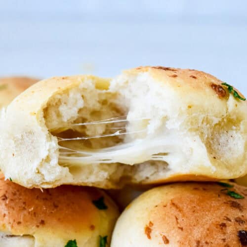 A mozzarella doughball with the melted cheese showing.