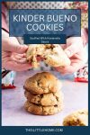 A Pinterest graphic. A person is breaking open a Kinder Bueno cookie over a stack of them to reveal the centre.