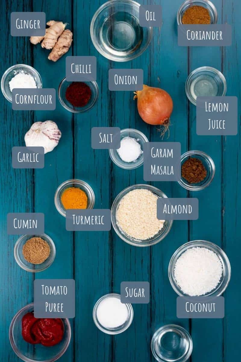A labelled photo with all the ingredients needed to make korma Curry paste.