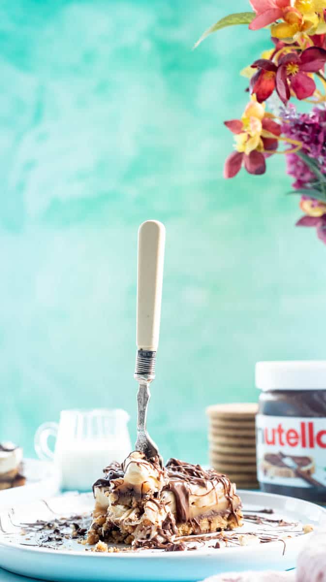 A fork is stuck in the middle of a slice of Nutella Banoffee Pie.