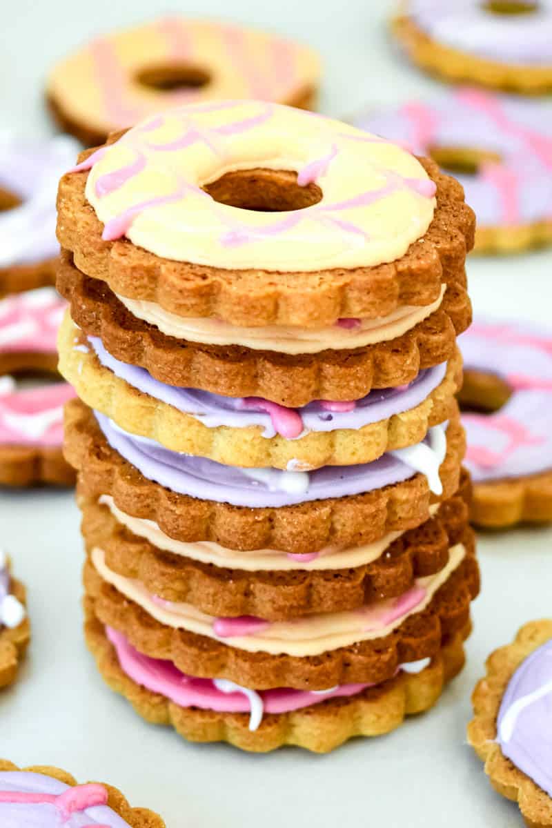 A stack of Party Rings Biscuits with more laid out in the background.