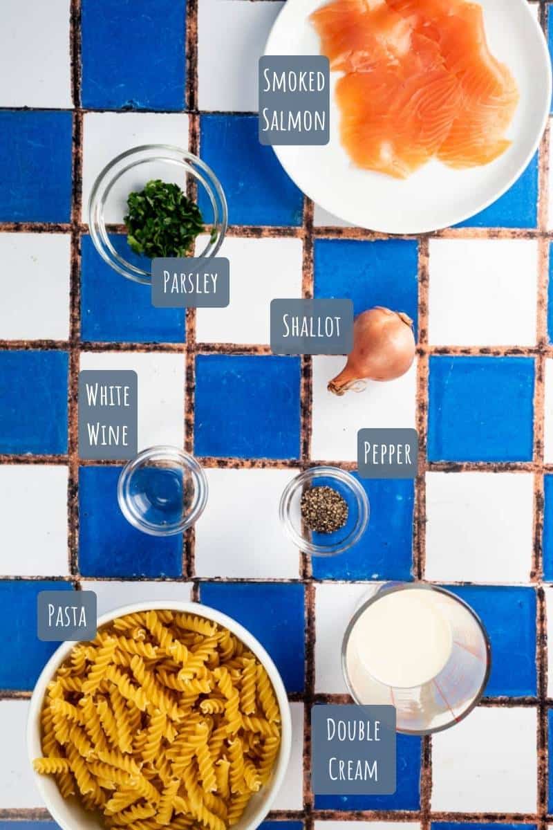A labelled photo of all the ingredients needed to make smoked salmon fusilli pasta.