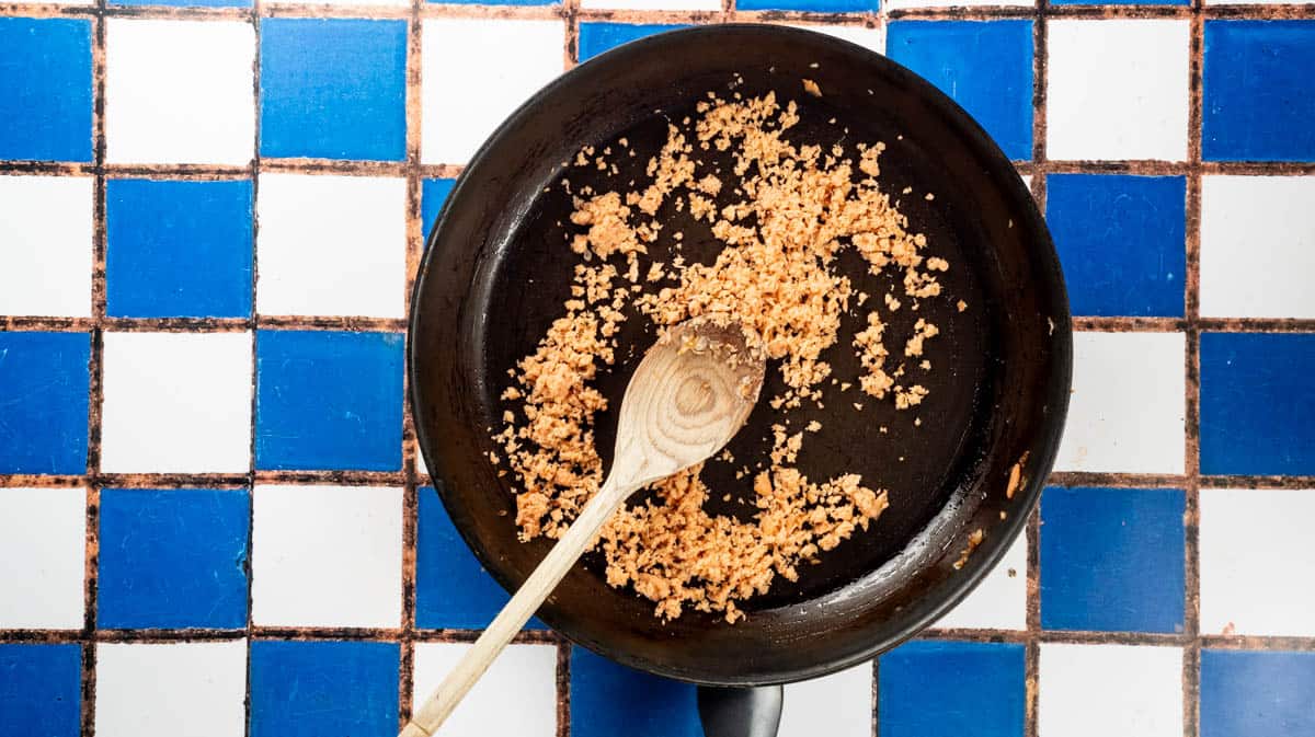A frying pan filled with blended smoked salmon.