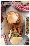 A Pinterest graphic, two burgers are sat on a wooden board, one is slightly open to show the filling. They are surrounded by ingredients and red decorations.